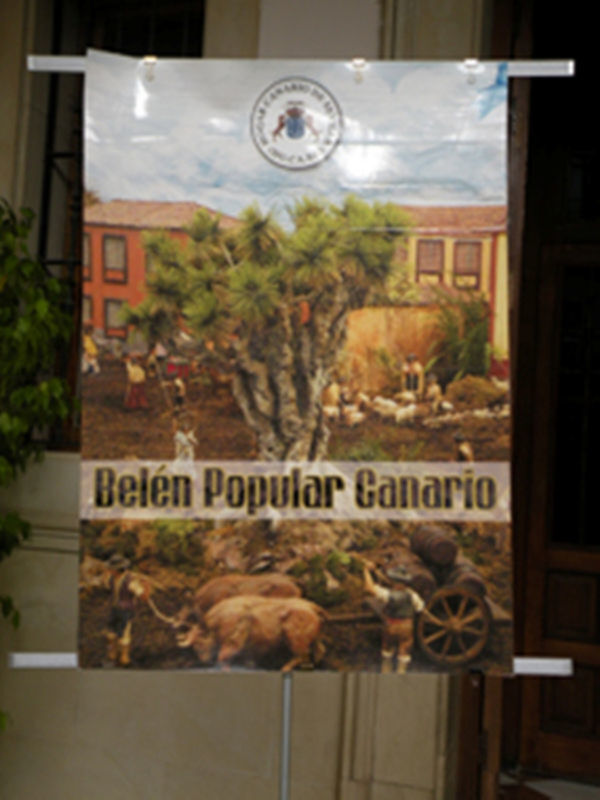 "Belén Popular Canario" muestra una escena pastoral con animales y arado, ilustrando la tradición navideña en el archipiélago canario.