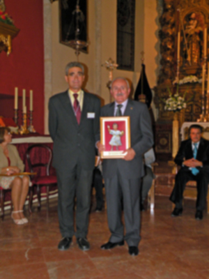 Provincia.El Profesor e Historiador D. Manuel Morales Morales, pronuncio una disertación, sobre el canto de la Sentencia de Pilatos en la Hermandad de Jesús Nazareno de Alcalá del Río.
